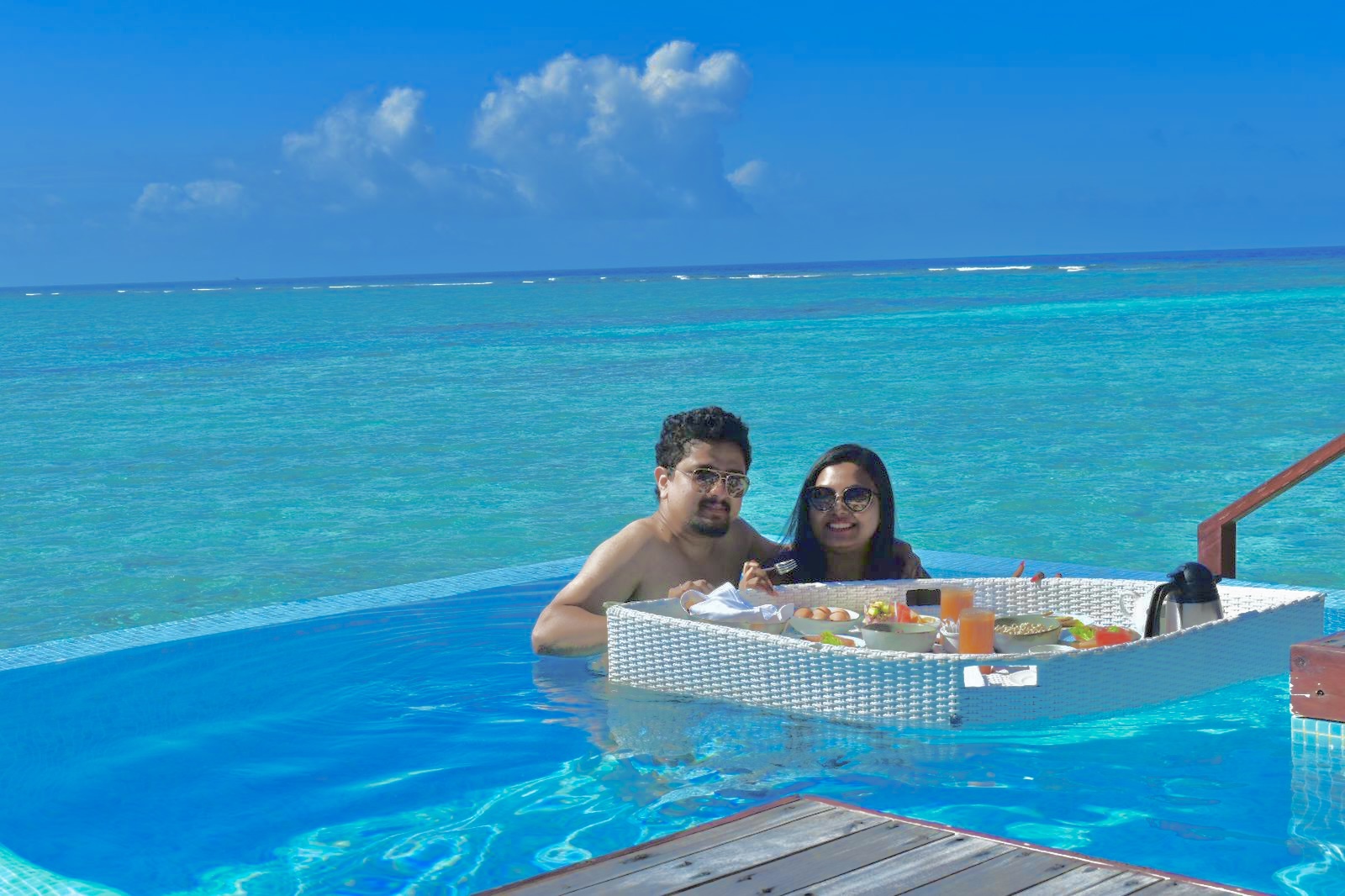 Floating breakfast in the pool of an overwater villa in the Maldives